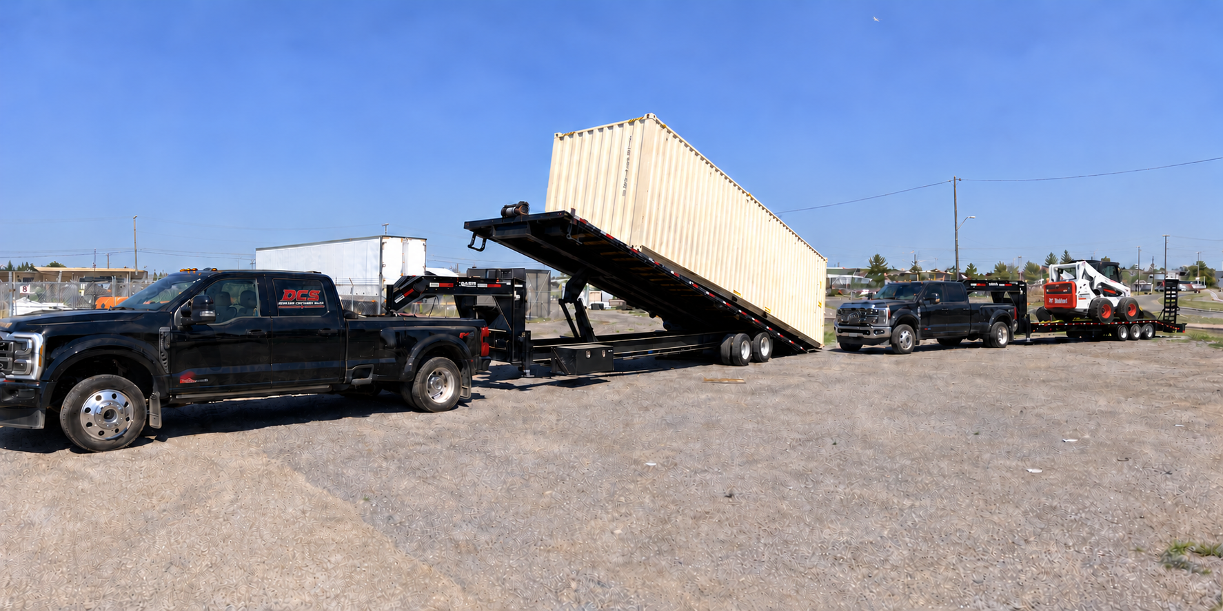 DCS tilt-deck container delivery truck and equipment-hauling truck carrying a skid steer